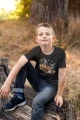 AnyConv.com__t-shirt-mockup-of-a-boy-sitting-on-a-log-2924-el1.webp