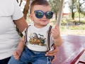AnyConv.com__little-baby-boy-wearing-big-sunglasses-and-a-round-neck-tee-mockup-with-his-mom-a16080.webp