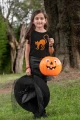 AnyConv.com__mockup-of-a-girl-wearing-a-t-shirt-and-a-witch-costume-in-the-woods-29296.webp
