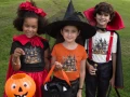 AnyConv.com__mockup-of-three-kids-wearing-a-t-shirt-and-costumes-for-halloween-29310.webp