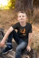 AnyConv.com__t-shirt-mockup-of-a-boy-sitting-on-a-log-2924-el1.webp