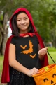 AnyConv.com__t-shirt-mockup-of-a-happy-girl-in-a-red-coat-holding-a-pumpkin-bag-29281.webp